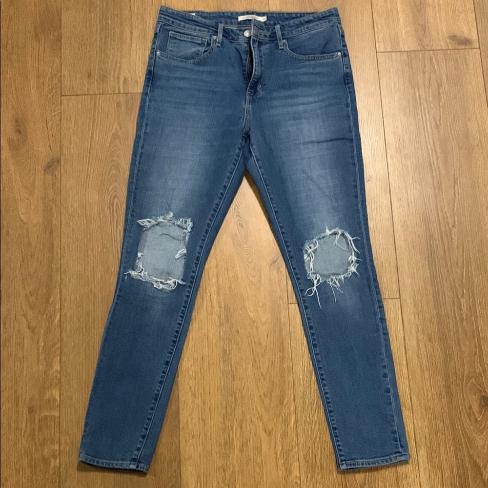 Distressed Blue Denim Jeans